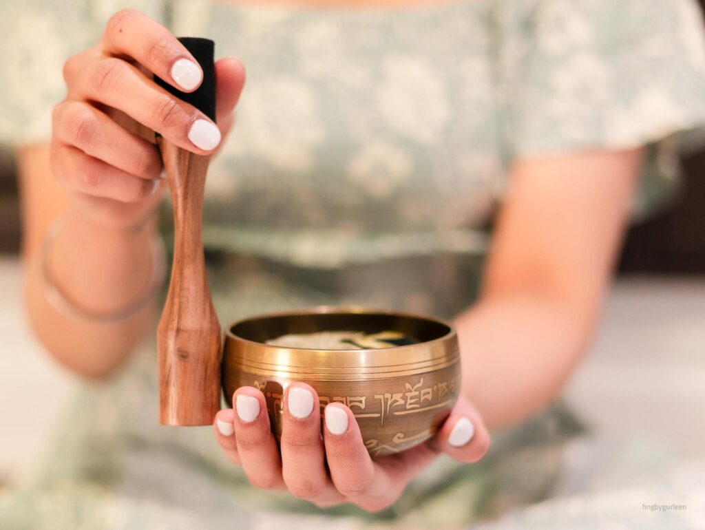 Person holding a singing bowl